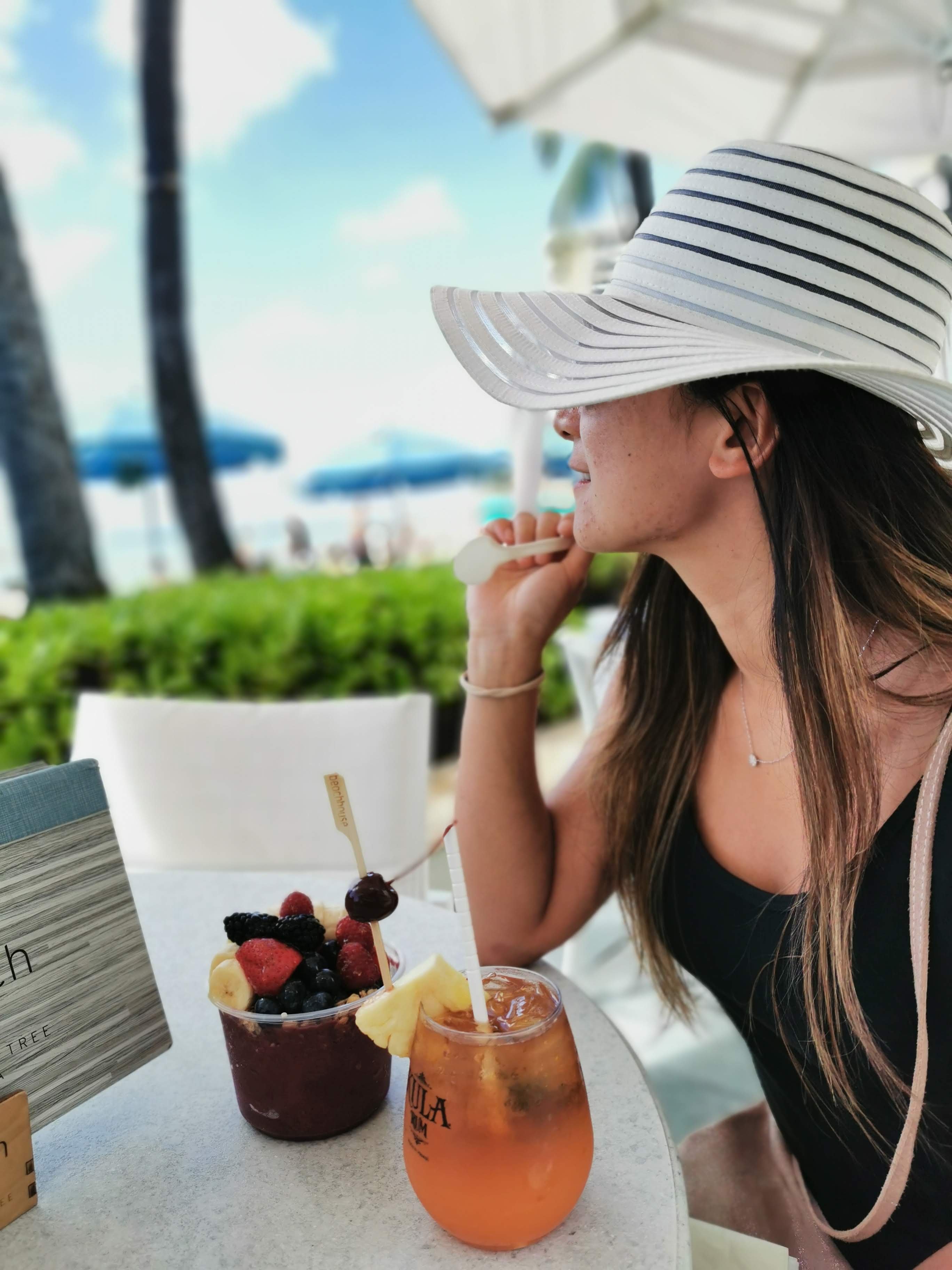 Stop for a drink at the Moana Surfrider. The place is open to the public so just coming here to sit watch the ocean is already great. jj at bar