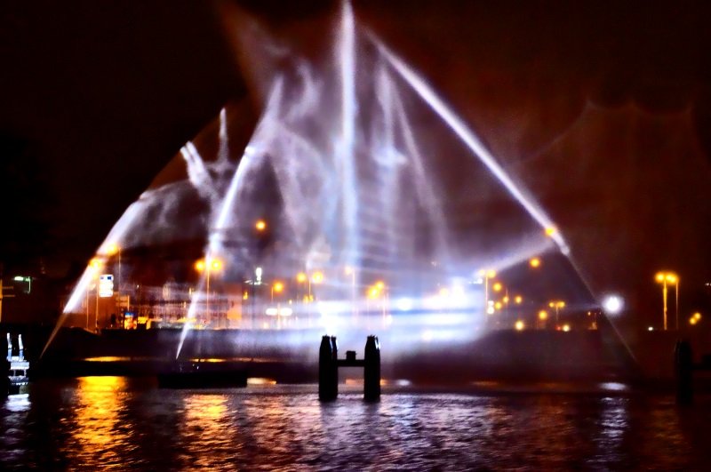 This resembles an image of a boat, created by shooting water in the air and turning lights on it in a certain angle Boat