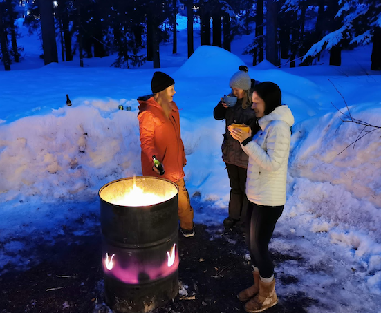 Chatting with the locals at the fire barrel over some hot drinks Firepit