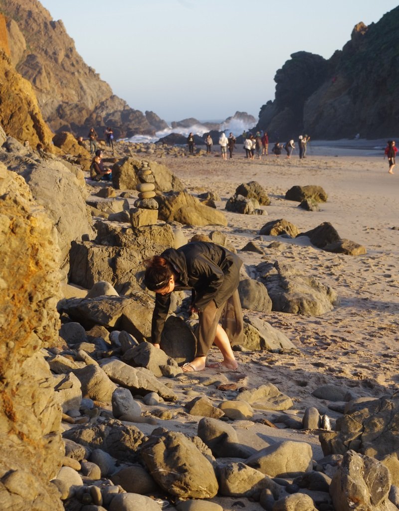 JJ collecting stones at Pfeiffer Beach