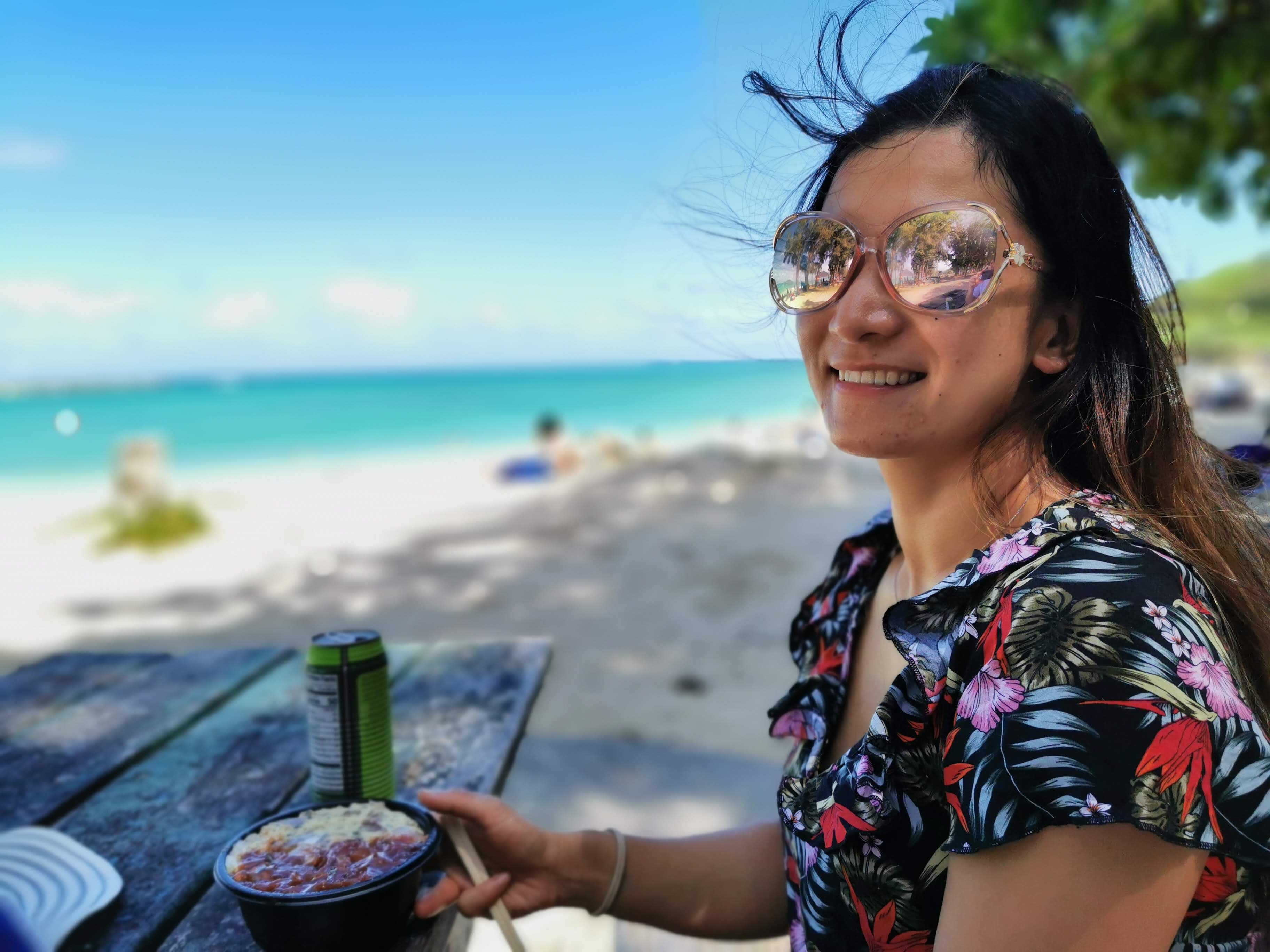Typical Hawaiian lunch: Poke and Coconut Water JJ eating at Lanikai Beach